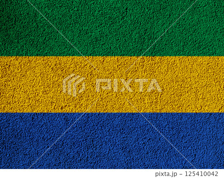 Flag of Republic of Gabon on a textured background. Concept collage. 125410042