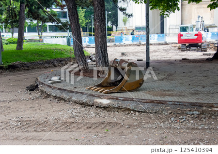 Vienna, Austria - 05.13.2023: Detached bucket of the escort lying on the ground Vienna, Austria - 05.13.2023: Detached bucket of the escort lying on the ground 125410394