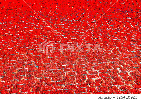 Red granite pavement. Granite paving stones, red stone, colorful background 125410923