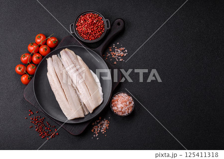 Herring fillet salted and marinated with salt, spices and oil 125411318