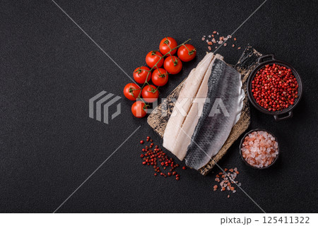 Herring fillet salted and marinated with salt, spices and oil 125411322