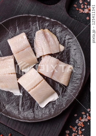 Herring fillet salted and marinated with salt, spices and oil 125411341