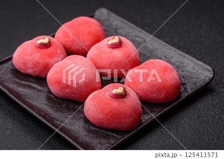 Delicious sweet mochi in the shape of red hearts Delicious sweet mochi in the shape of red hearts 125411571