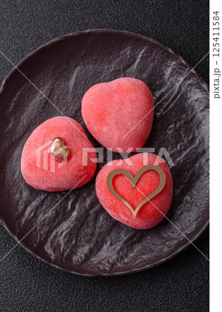 Delicious sweet mochi in the shape of red hearts Delicious sweet mochi in the shape of red hearts 125411584
