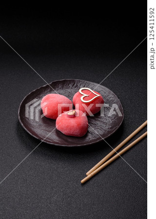 Delicious sweet mochi in the shape of red hearts 125411592