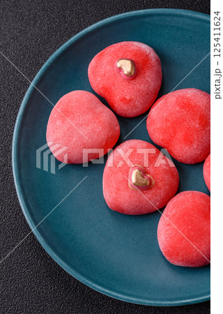 Delicious sweet mochi in the shape of red hearts Delicious sweet mochi in the shape of red hearts 125411624