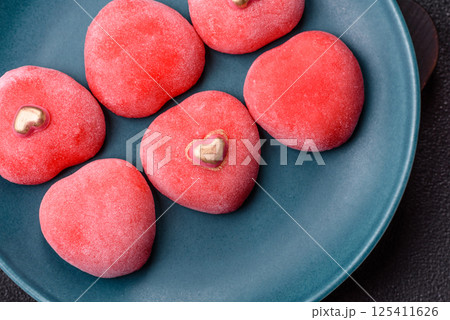 Delicious sweet mochi in the shape of red hearts 125411626