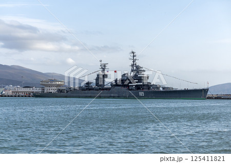 Novorossiysk, Russia - 18 August 2023. Cruiser Mikhail Kutuzov and dolphins, Black Sea, port, Krasnodar Territory, Novorossiysk. 125411821