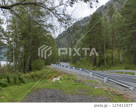Cinematic landscape the road leaving for the mountains in the early morning 125411877