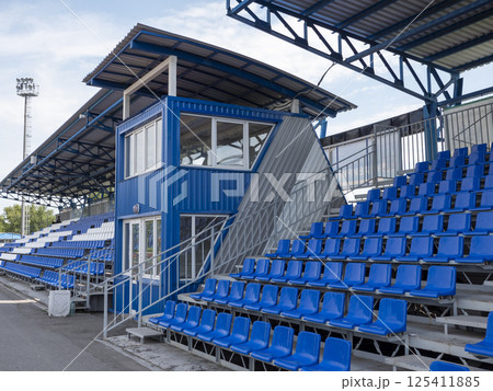 Armchairs seats blue chairs at the sport stadium Armchairs seats blue chairs at the sport stadium 125411885