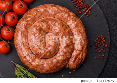 Delicious homemade sausage in the shape of a snail or spiral 125412075