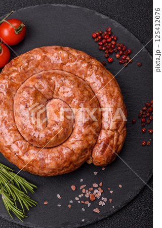Delicious homemade sausage in the shape of a snail or spiral 125412076