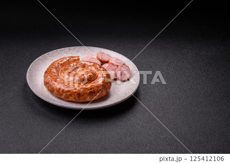 Delicious homemade sausage in the shape of a snail or spiral Delicious homemade sausage in the shape of a snail or spiral 125412106