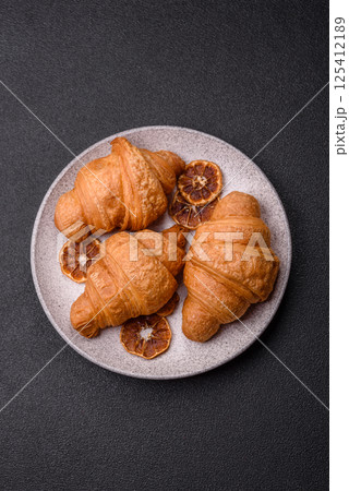 Sweet crispy croissants with chocolate filling Sweet crispy croissants with chocolate filling 125412189