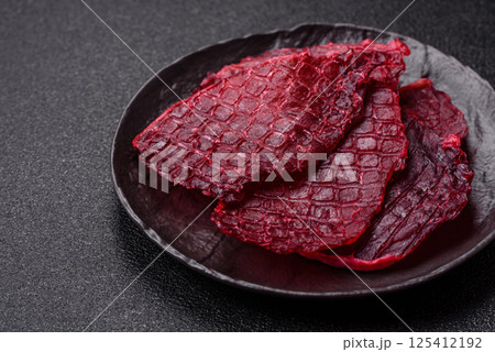 Dried beef slices, jerky, with cherry or plum flavor, salt and spices 125412192