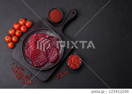 Dried beef slices, jerky, with cherry or plum flavor, salt and spices Dried beef slices, jerky, with cherry or plum flavor, salt and spices 125412200