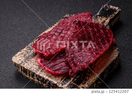 Dried beef slices, jerky, with cherry or plum flavor, salt and spices Dried beef slices, jerky, with cherry or plum flavor, salt and spices 125412207