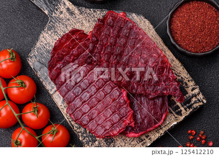 Dried beef slices, jerky, with cherry or plum flavor, salt and spices 125412210