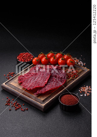 Dried beef slices, jerky, with cherry or plum flavor, salt and spices 125412220