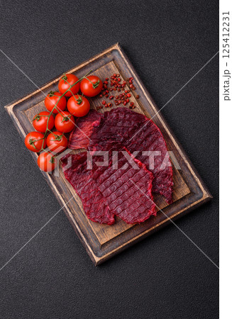 Dried beef slices, jerky, with cherry or plum flavor, salt and spices 125412231