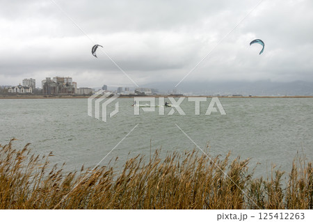 Novorossiysk, Russia 08.18.2024 kite surfer rides and jumps the waves the black sea 125412263