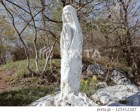 marble statue in the mountain dedicated to the Virgin Mary marble statue in the mountain dedicated to the Virgin Mary 125412387