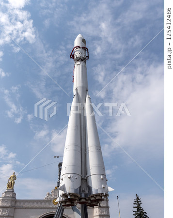 MOSCOW, RUSSIA - APRIL 23, 2024: Booster rocket Vostok at the pavilion Space on VDNCH. Walking Muscovites and tourists MOSCOW, RUSSIA - APRIL 23, 2024: Booster rocket Vostok at the pavilion Space on VDNCH. Walking Muscovites and tourists 125412486