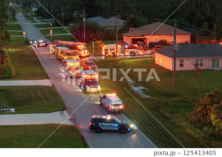 Firefighters investigating fire hazard on residential street in North Port in Florida Firefighters investigating fire hazard on residential street in North Port in Florida 125413405