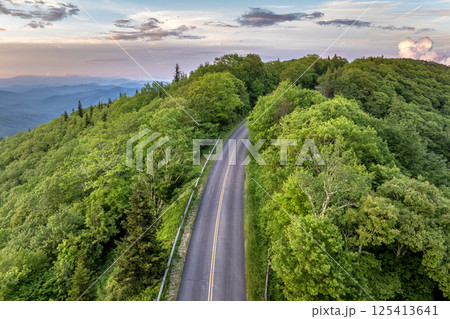 Car road trip on Blue Ridge Parkway in North Carolina Appalachian mountains in summer season at sunset. Summertime landscape of beautiful nature Car road trip on Blue Ridge Parkway in North Carolina Appalachian mountains in summer season at sunset. Summertime landscape of beautiful nature 125413641