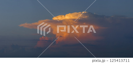 Amazing sunset skyscape. Evening sky with bright colorful orange and yellow clouds 125413711
