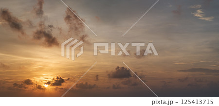 Amazing sunset skyscape. Evening sky with bright colorful orange and yellow clouds 125413715