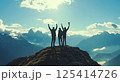 People are standing hand in hand on a mountain in unity 125414726