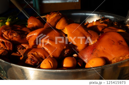 Stewed pork leg on boiled pot. 125415973
