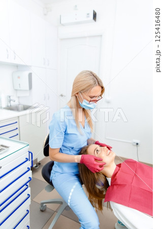 generous facial joints, osteopath performs, facial massage joints, checking teeth, oral care, healthy teeth, Dental treatment 125416480