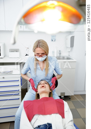 facial joints, doctor examining, checking teeth, dentist office, dentistry clinic, dental instruments facial joints, doctor examining, checking teeth, dentist office, dentistry clinic, dental instruments 125416485