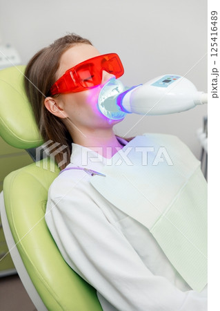 Doctor dentist, dentistry clinic, teeth whitening, dental health, dentist examining, whitening procedure dentistry professional 125416489