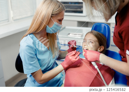 checking teeth, child dentist patient, Professional stomatology kid, professional doctor fixing teeth, dental specialist 125416582