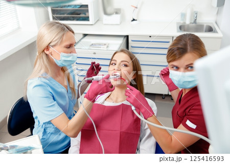 dental intervention, dental check-up, dental inspection, medical procedure, smiling patient, oral hygiene 125416593