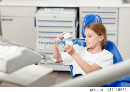 treatment teeth, Portrait child dentist, dental care, Dental treatment, Little girl visiting dentist, small child, dental clinic appointment 125416682