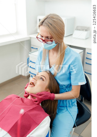 generous facial joints, osteopath performs, facial massage joints, checking teeth, oral care, healthy teeth, Dental treatment 125416683