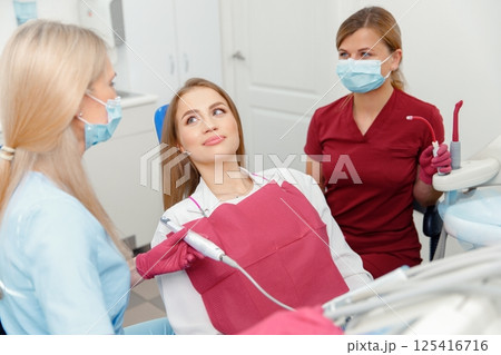 dental intervention, dental check-up, dental inspection, medical procedure, smiling patient, oral hygiene 125416716