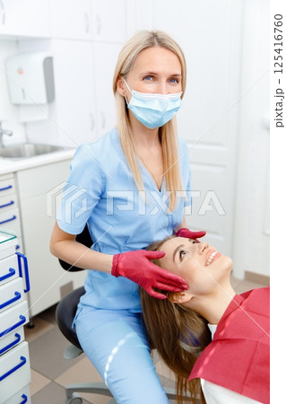 generous facial joints, osteopath performs, facial massage joints, checking teeth, oral care, healthy teeth, Dental treatment generous facial joints, osteopath performs, facial massage joints, checking teeth, oral care, healthy teeth, Dental treatment 125416760