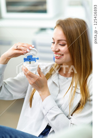 smiling dentist patient, dental chair, dentist patient, dentistry clinic, dental procedure, Smiling dentist communicating, dental instruments smiling dentist patient, dental chair, dentist patient, dentistry clinic, dental procedure, Smiling dentist communicating, dental instruments 125416893
