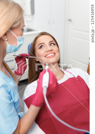 dental specialist, teeth check, dental diagnosis, dental care, dental examination, professional doctor fixing teeth, healthy teeth 125416959