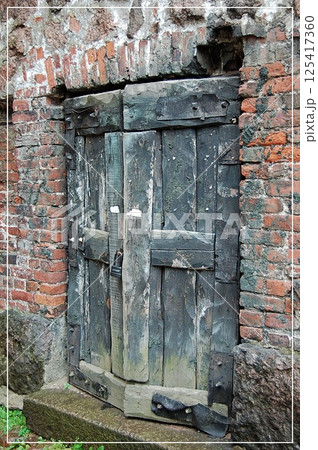 Weathered Wooden Door Rustic Brick Wall 125417360