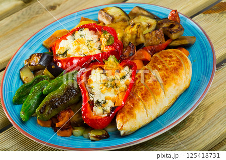 Plate with baked vegetables and chicken fillet 125418731