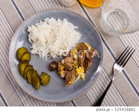 Top view gray ceramic plate of flavored omelet with rabbit liver with rice and pickles Top view gray ceramic plate of flavored omelet with rabbit liver with rice and pickles 125418801