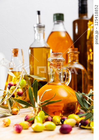 Decanters and bottles with olive oil Decanters and bottles with olive oil 125418852