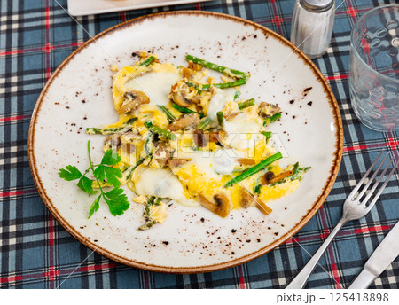Popular breakfast of Spanish cuisine is Revuelto Popular breakfast of Spanish cuisine is Revuelto 125418898
