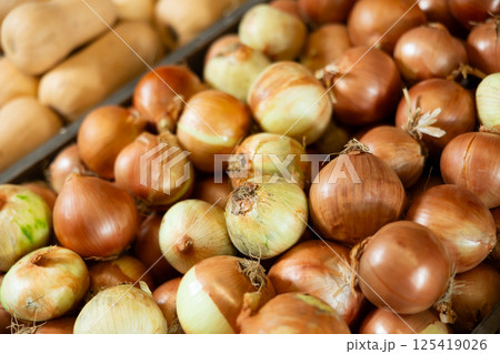 Close-up view of onions placed in box in market 125419026